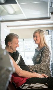 Therapist Jillian Goodwin sets up Steve Kalotinis, 67, with the Game Ready ice and compression unit at the David Braley sport medicine clinic at McMaster.