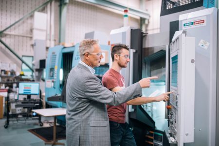 Stephen Veldhuis working with colleague at McMaster Manufacturing Research Institute