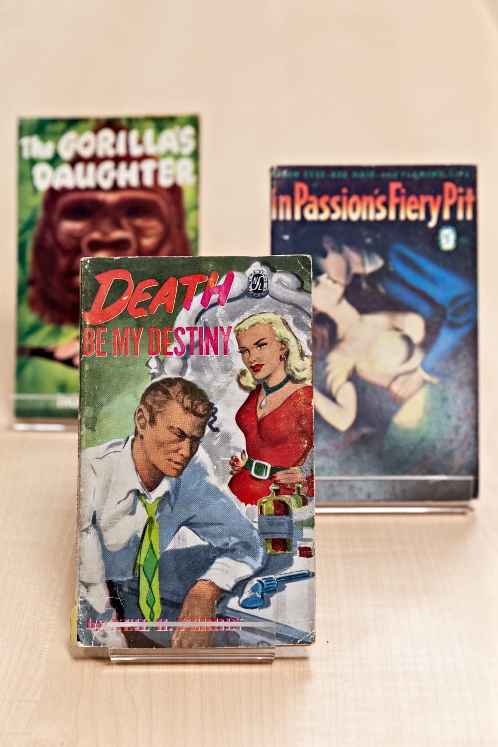 The Gorilla’s Daughter by Thomas P. Kelley, Death Be My Destiny by Danny Halpern (under the pseudonym Neil H Perrin) and In Passion’s Fiery Pit, by Joy Brown, later known by her married name, Joy Carroll, are just three of the titles contained in the Canadian pulp fiction collection recently donated to McMaster University by poet, bookseller and publisher, Nelson Ball.