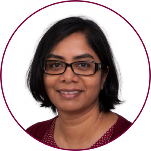 A headshot of Padmaja Subbarao on a white backdrop enclosed in a maroon circle