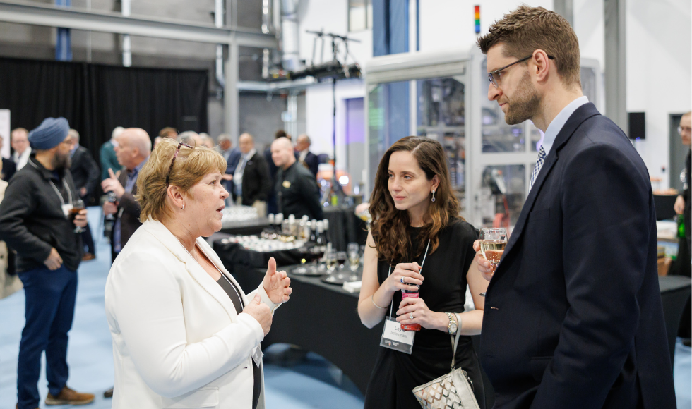 Three people talking at the MIP reception