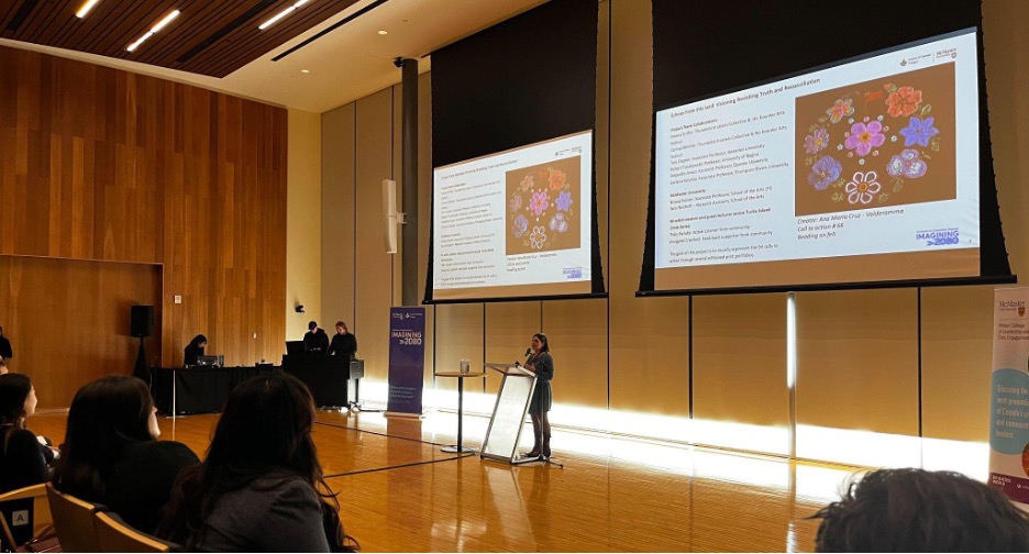 A student speaks at a lectern.