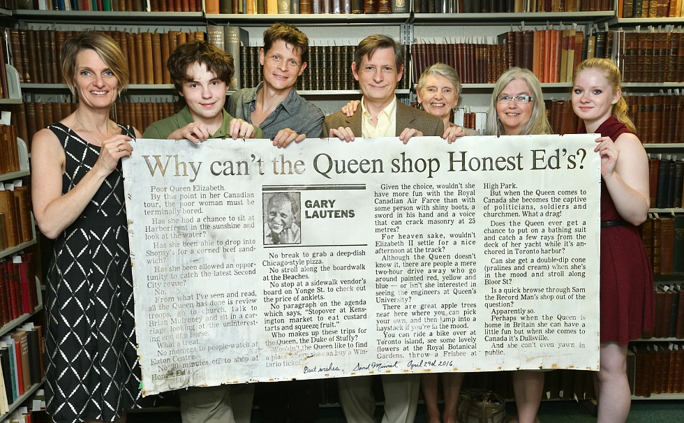 The family of award-winner writer and McMaster alumnus Gary Lautens with a column written by Lautens that was displayed for more than 30 years outside Honest Ed’s. Left to right: Jane (daughter); James (grandson, son of Stephen and Rhea); Richard (son); Stephen (son); Jackie (wife); Rhea (Stephen’s wife); Chelsea (granddaughter, daughter of Jackie; currently a Mac student).