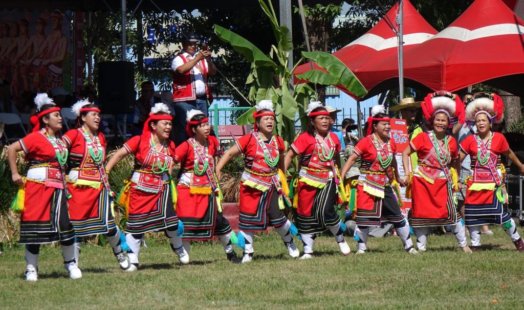 Members of the Indigenous Amis tribe in traditional costumes participate in the yearly harvest festival in Kaohsiung, Taiwan in September 2018.