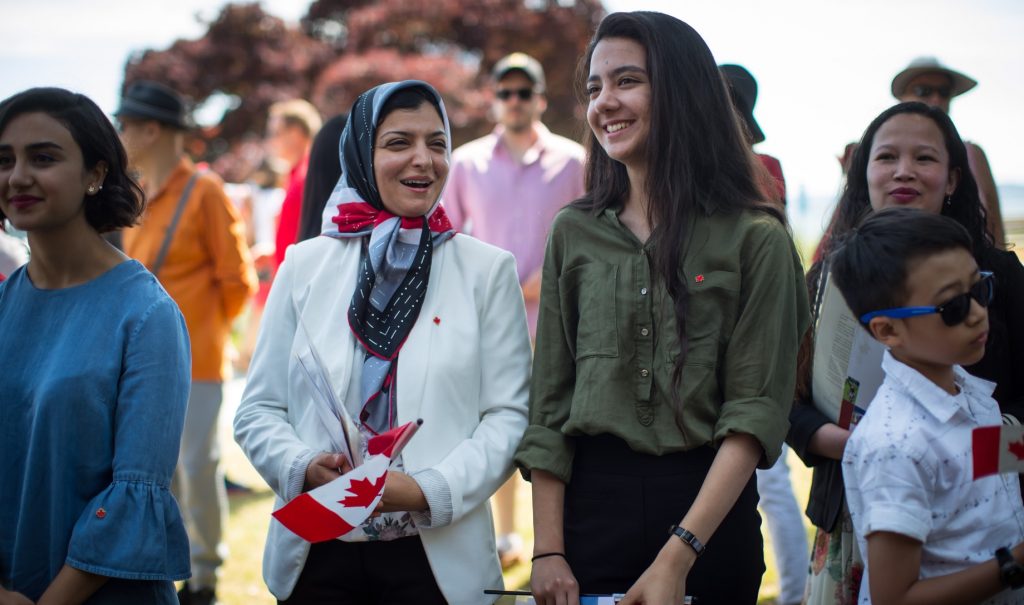 Smiling families at citizenship ceremony