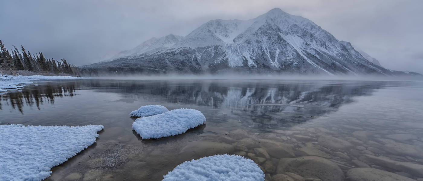 landscape of the Yukon in winter, partially melted water