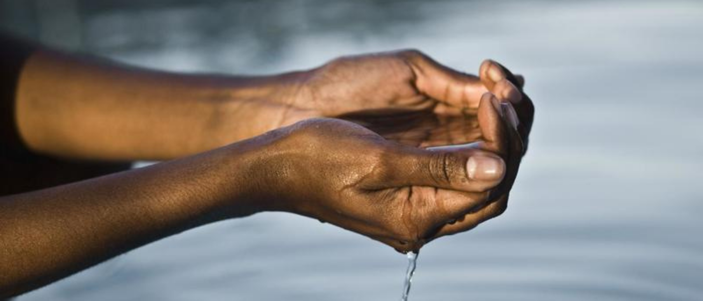 Hands cupping water