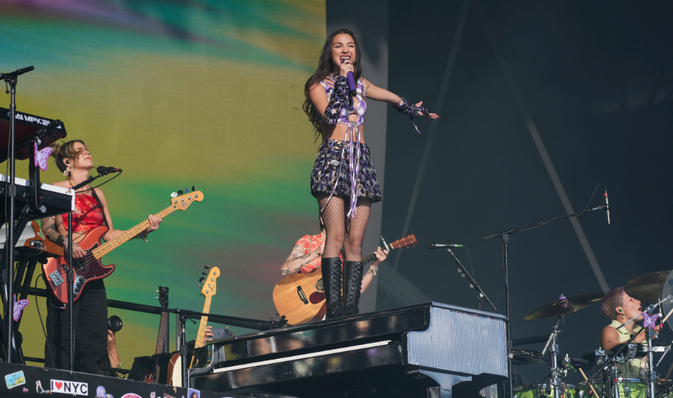 Olivia Rodrigo performs on stage.