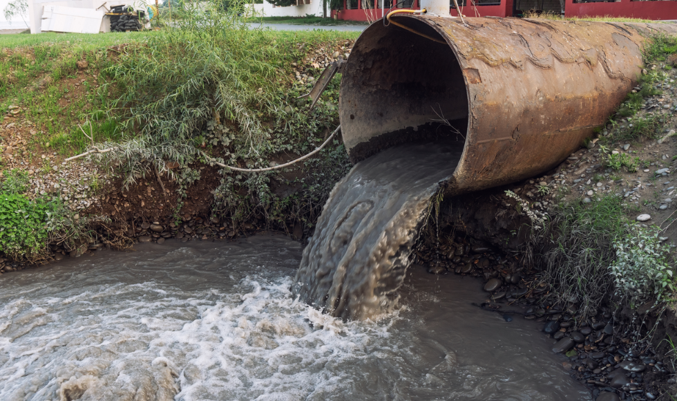 An overflow drain dumps waste water.