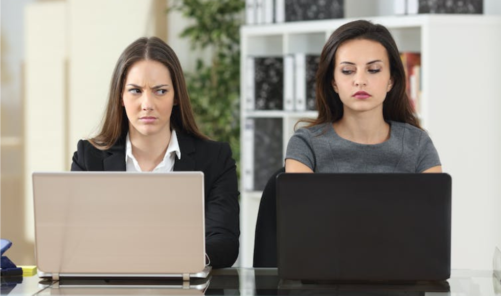 Image of two women jealously staring at one another