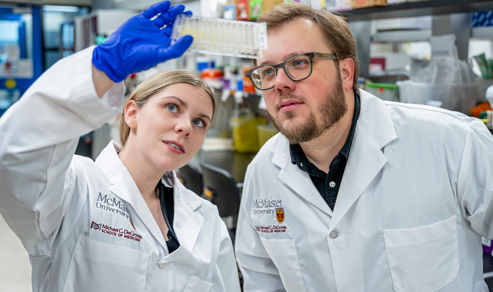 McMaster University researchers Allyssa Phelps and Josh Koenig can be seen posing for an image.