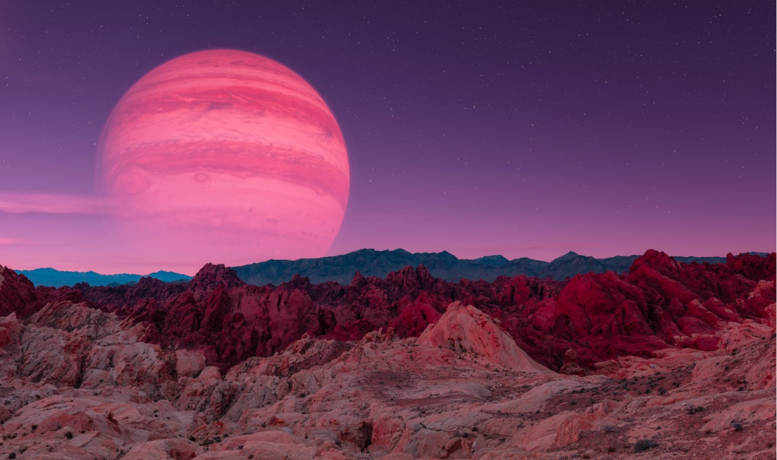 a stripey planet looms in a purple sky above a rocky landscape.